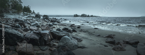 Panorama of a rocky shore. Overcast day. Background for travel materials