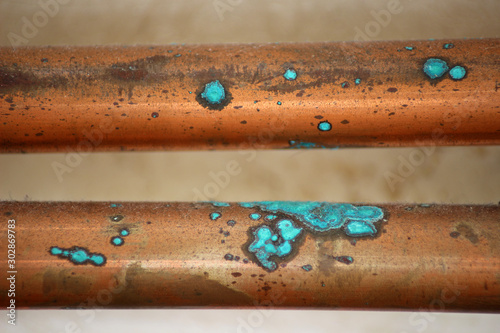 Oxidized Copper Pipes. Close up of Oxidation on Copper Central Heating Pipes