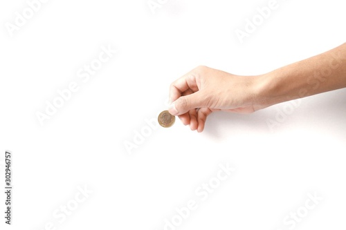 coins in hand euro coins are being filed with the hand of women change coin gold finance on the white background