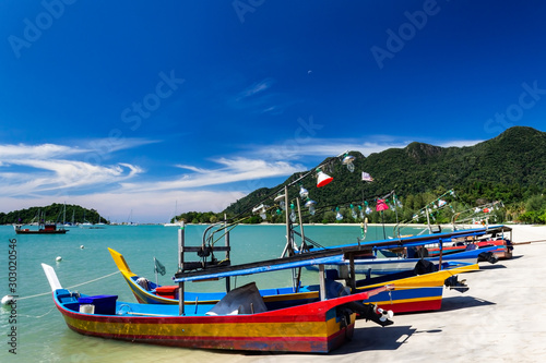 Telaga Harbor beach with colourful squid fishing boats on Langkawi island, also known as Pulau Langkawi, Andaman Sea, State of Kedah, Malaysia.