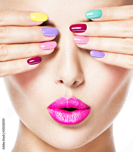 woman with colored nails and pink lips