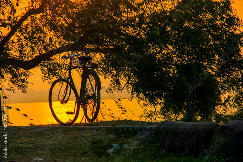 Sun rise or sunset view on lake side between cycle 
