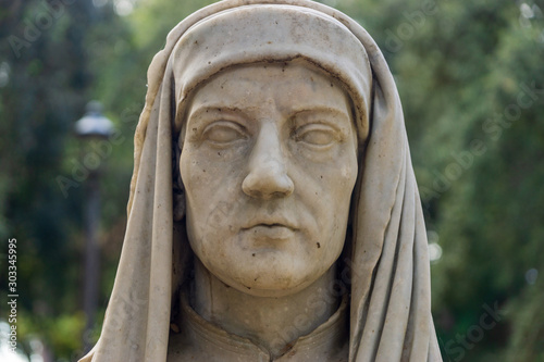 Old marble bust of Giotto in the public park Pincian Hill, Villa Borghese gardens, Rome, Italy