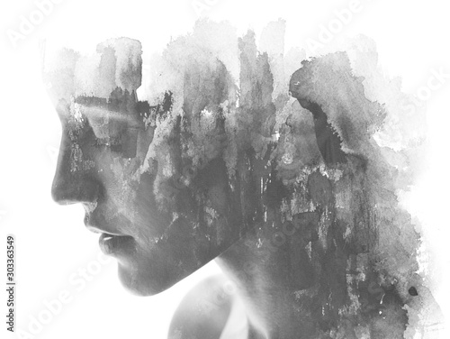 Paintography. Double exposure. Close up of an attractive model combined with hand drawn ink and watercolor painting with overlapping brushstroke texture, black and white