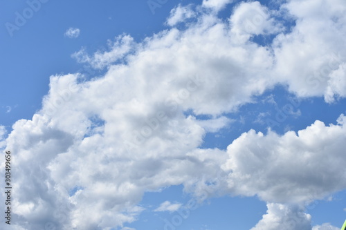 sky blue with white curly clouds