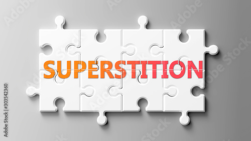 Superstition complex like a puzzle - pictured as word Superstition on a puzzle pieces to show that Superstition can be difficult and needs cooperating pieces that fit together, 3d illustration