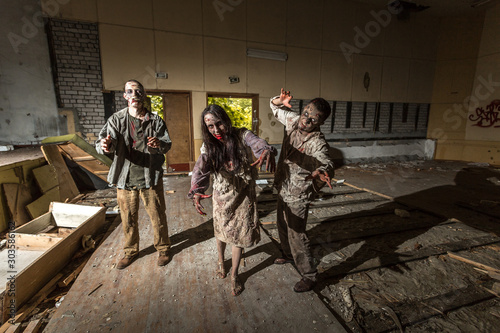 Zombies attack in an abandoned dark building