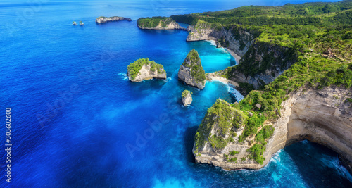 Aerial view at sea and rocks. Azure water background from top view. Panoramic seascape. Kelingking beach, Nusa Penida, Bali, Indonesia. Travel Asia - image