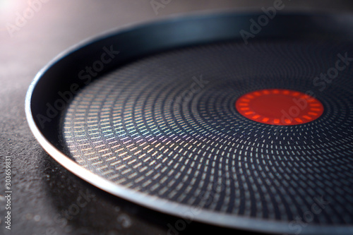 Teflon pan with non-stick coating close up on a cuisine table