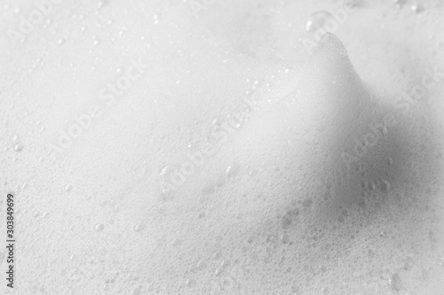 White peak from soap foam or shampoo foam with copy space