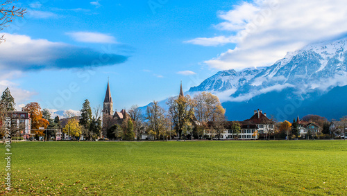Village Interlaken. Well-known tourist destination in the Bernese Highlands region of the Swiss Alps, and the main transport gateway to the mountains and lakes of that region.