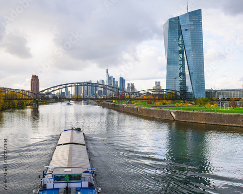 River transport by barge in Frankfurt am Main with the skyscrapers in the background