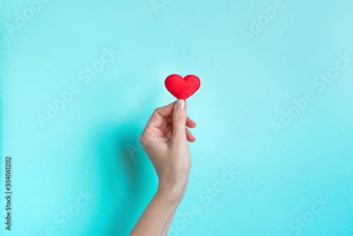 Hand holding Red Heart
