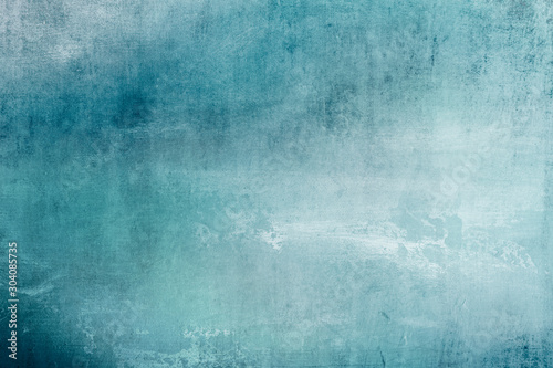 grungy blue stained canvas background or texture