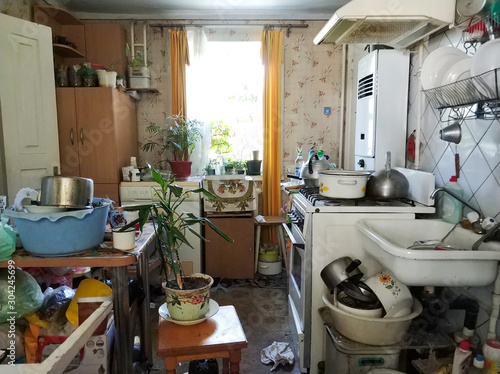 mess and dump. An old room with lots of things. Devastation. Very small housing