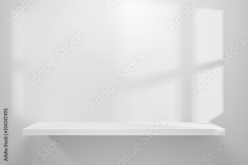 Front view of empty shelf on white table showcase and wall background with natural window light. Display of backdrop shelves for showing minimal concept. Realistic 3D render.