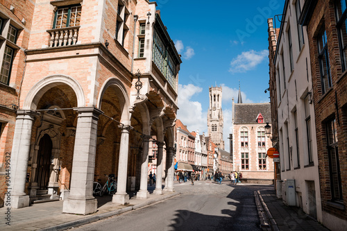 Ancient street of the old city of Brugge in Belgium. An empty street extending into the distance in sunny weather.