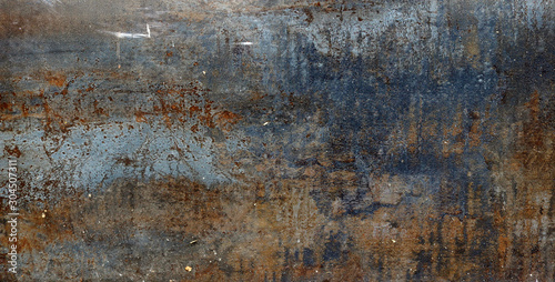rusty metal surface with red, black and orange tones - worn steampunk background with scratches