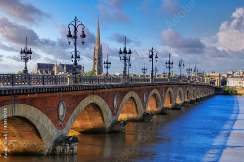 Scenic view of Bordeaux river bridge with St Michel cathedral, France