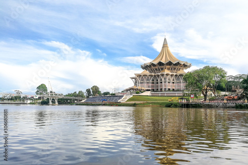 The Darul Hana bridge across Sarawak River overseeing the Sarawak State Assembly Building is popular tourist destination in Kuching.