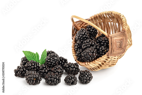 blackberry with leaf in a wicker basket isolated on a white background closeup