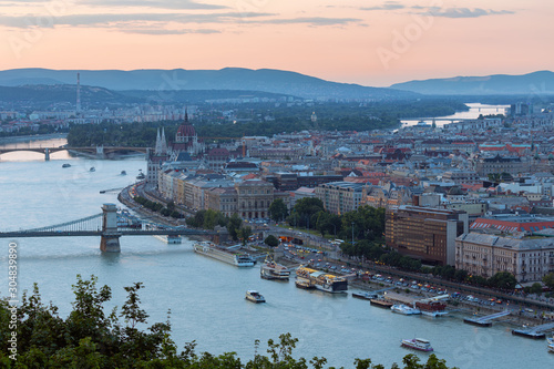 Sunset Budapest along Danube with Chain Bridge and Parliament Building