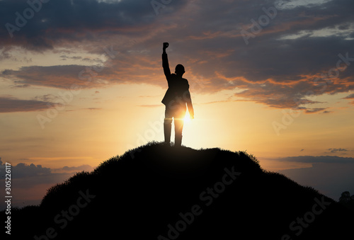 silhouette of man standing on the hill,Business, success,victory,leadership,achievement concept.