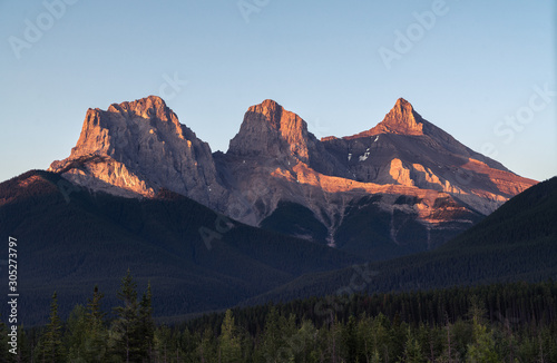 Morning Glow on the Three Sisters of Canmore Alberta 