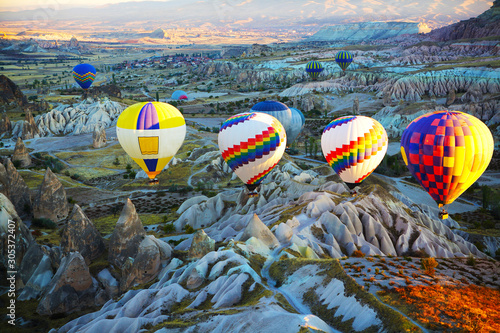 Hot air balloon flight in autumn in Cappadocia national Park. Valley of love. Meet the dawn.