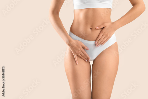 Young woman on light background, closeup. Gynecology concept