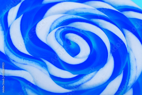 Blue round Lollipop close-up . Minimal concept with copy space.
