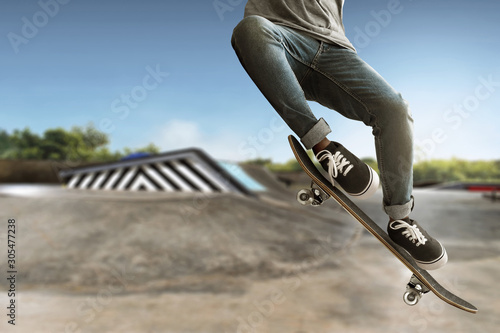 Skateboarder skateboarding at skate park