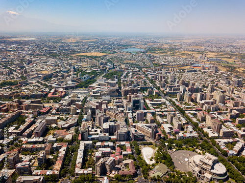 Yerevan cityscape from aerial view. Cascade park. Ararat mountain. Old armenian architecture. Road through the city. Armenia from above. Modern city skyline