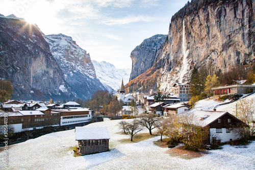 amazing touristic alpine village in winter with famous church and Staubbach waterfall Lauterbrunnen Switzerland Europe