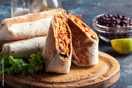 Burritos wraps with mincemeat, beans and vegetables