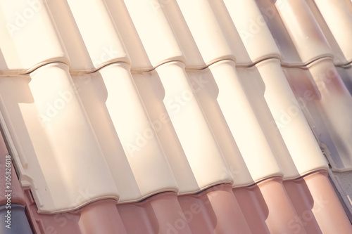 Samples of ceramic roofing tiles in a warehouse of a roofing mat