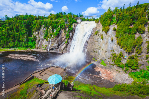 Landscape View of Montmorency Falls and Magnificent Rainbow in Montmorency Falls Park, Quebec, Canada