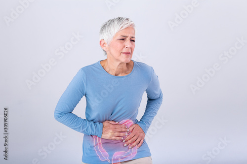 The photo of large intestine is on the senior woman body against gray background, People With Stomach ache problem concept, Female anatomy