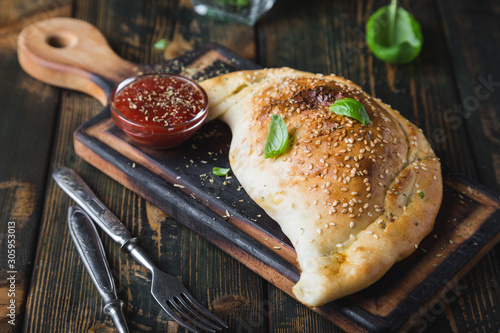 Calzone pizza with chicken and cheese