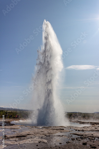 Strokkur big geyser eruption in summer Iceland lanscape, Big geyser in action outbreak, explosion