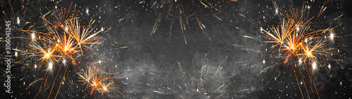 Silvester 2024, New Year's Eve, New Year, Festival Party celebration holiday background banner panorama - Firework fireworks on rustic dark black grey stone concrete texture
