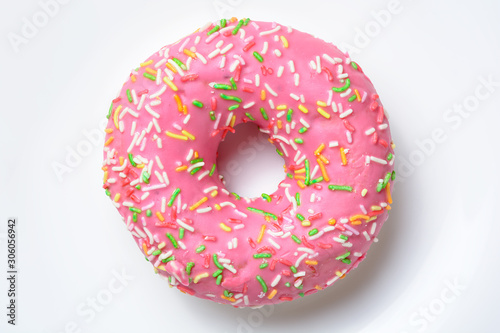 Pink donut on the white background. Close up