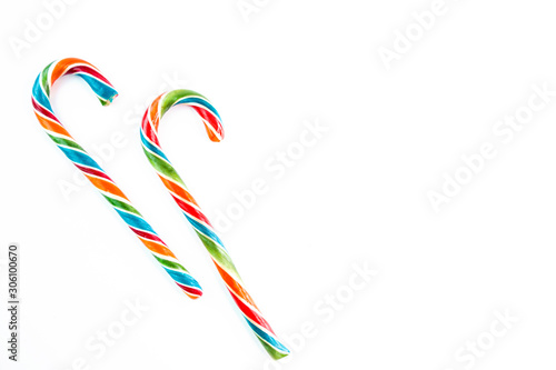 Two colorful festive Lollipop on white background selective focus top of view