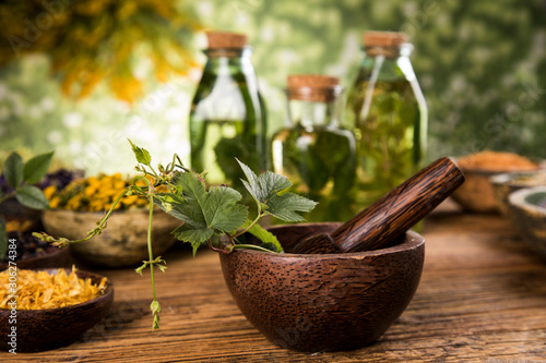 Herbs medicine and vintage wooden background