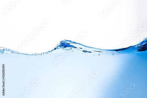 Blue water waves and bubbles isolated on a white background.