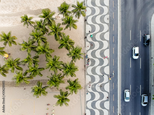 view of Copacabana boardwalk during late afternoon, taken with a drone, with the famous portuguese stone texture . Rio de Janeiro, Brazil