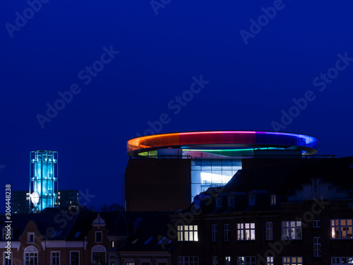 Modern Art Museum Aros, Rainbow and Aarhus City Hall in the blue hour skyline.