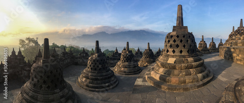 Panorama of Borobudur sacred temple, stunning ancient temple with black stone bells (stupa) in yogyakarta, Java, Indonesia.