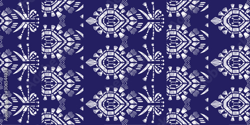 Drapery ikat navajo motif etnic white tribal ornamentalpattern on blue background. Surface background design for cotton fashion. Textile fabric ornament future rug.