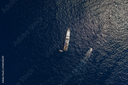 Aerial overhead drone shot of luxury yacht in Tyrrhenian sea near Capri Island in summer
